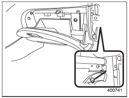 2. Unhook the strap.