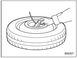 8. Tilt the retainer at the end of the cable