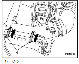 1. Unsnap the two clips holding the air