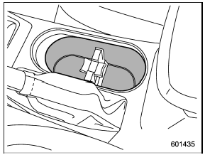 A dual cup holder is built into the console.