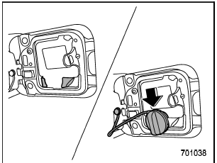 3. Set the fuel filler cap on the cap holder